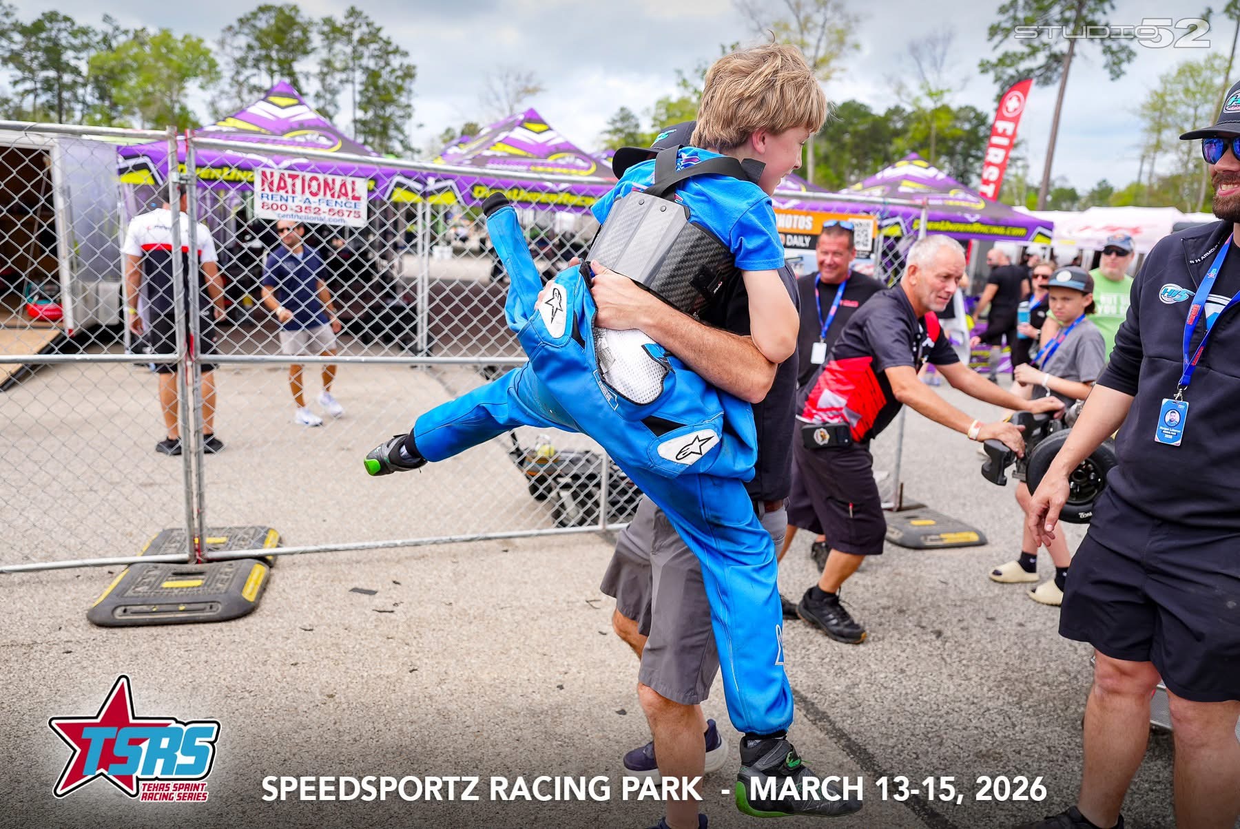 Post-race celebration hug in the paddock